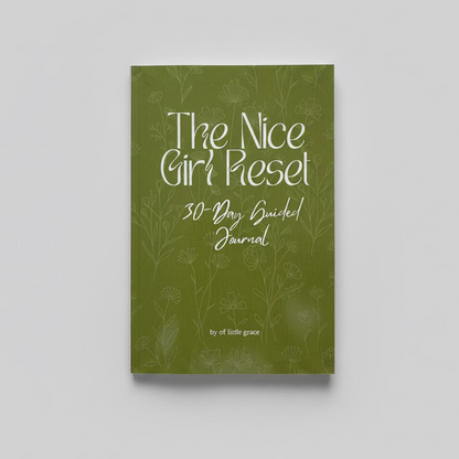Green journal titled 'The Nice Girl Reset 30-Day Guided Journal' on a textured white surface