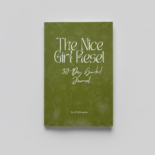 Green journal titled 'The Nice Girl Reset 30-Day Guided Journal' on a textured white surface