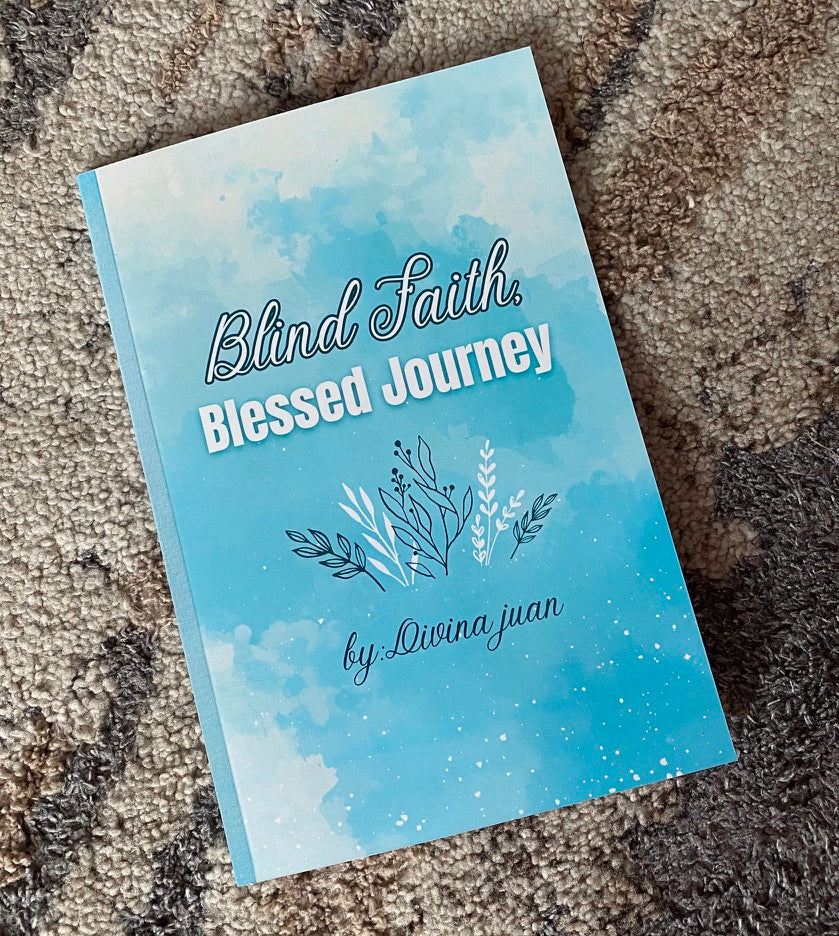 Book titled 'Blind Faith, Blessed Journey' by Divina Juan on a textured surface