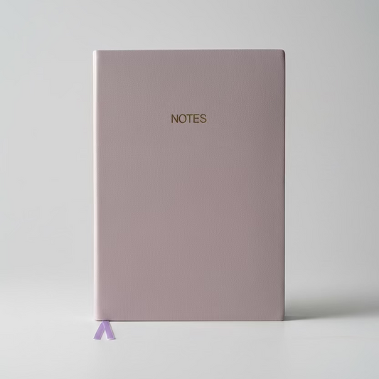 Purple notebook with 'NOTES' on a light gray background